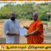 பௌத்த சின்னங்களை நிலங்களில் வீசி தொல்பொருள் நிலம் என அடையாளப்படுத்திய உயர் அதிகாரி