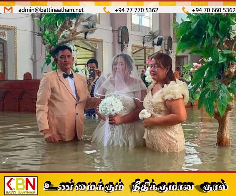 வெள்ளத்தையும் பொருட்படுத்தாது தேவாலயத்தில் திருமணம் செய்த இளம் ஜோடி!